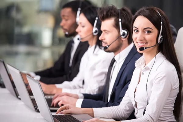 Call center employees working at desks.